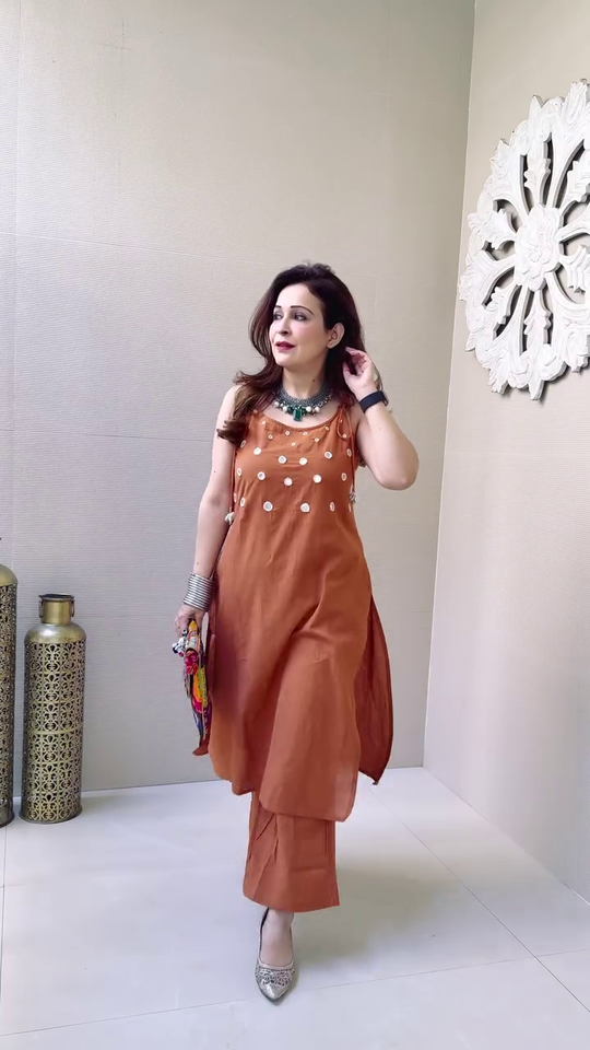 Elegant Sleeveless Mirror Work Kurta Set in Rust