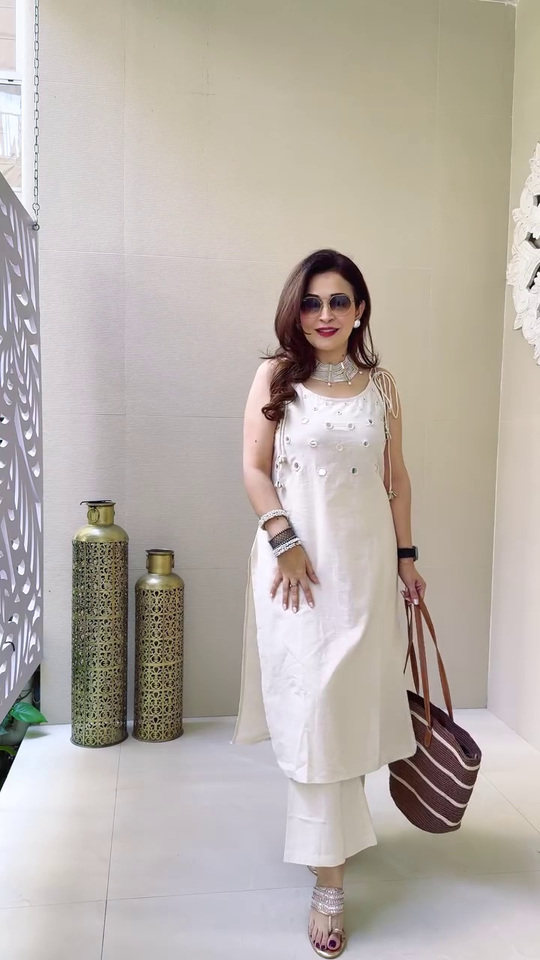 Elegant Sleeveless Mirror Work Kurta Set in Rust