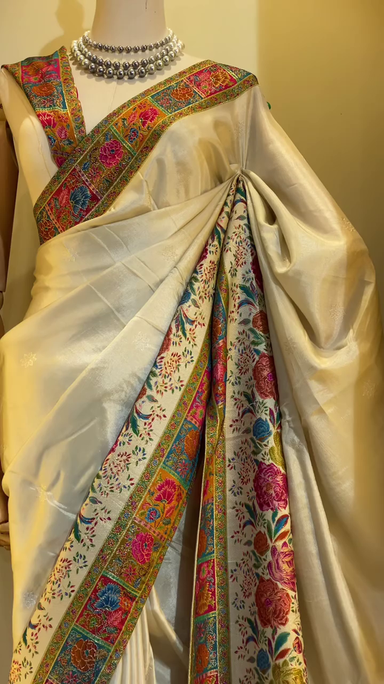 Elegant Cream Banarasi Silk Saree with Multicolor Floral Jaal Weaving, Rich Contrasting Zari Border, Traditional Pallu Design