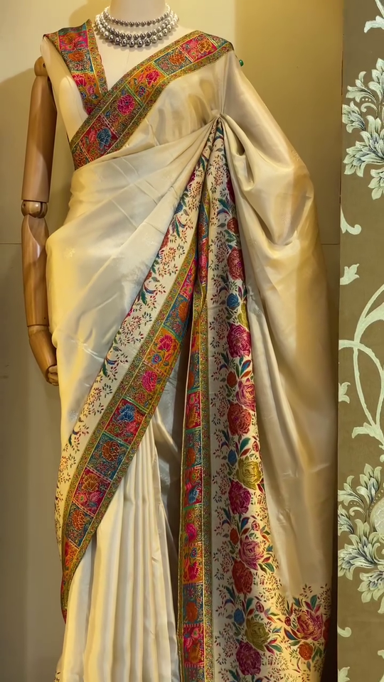 Elegant Cream Banarasi Silk Saree with Multicolor Floral Jaal Weaving, Rich Contrasting Zari Border, Traditional Pallu Design
